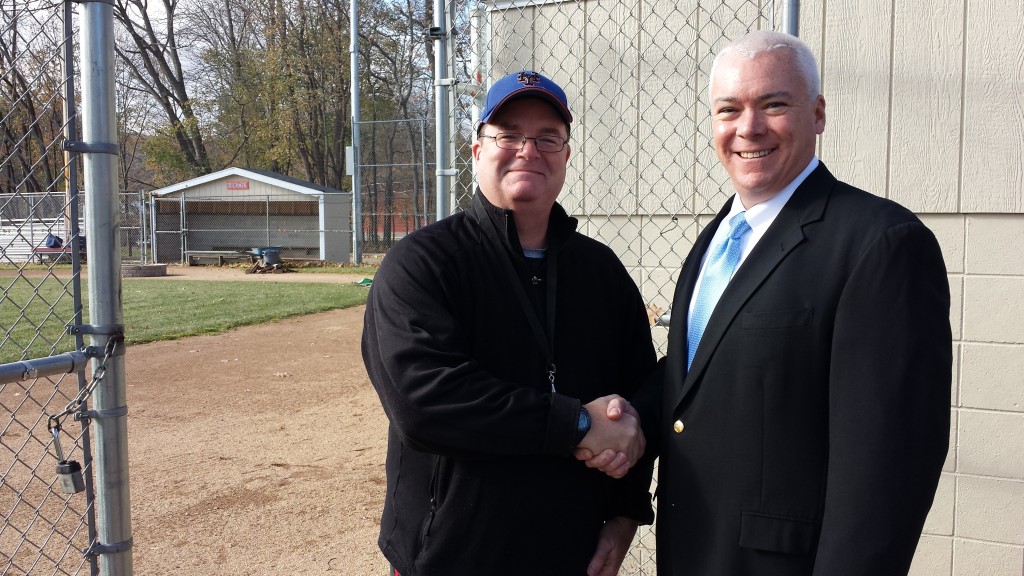 Anthony Cashman (left), President of the Jesse Burkett Little League, and Jack Woods (right), President of TJ Woods Insurance Agency