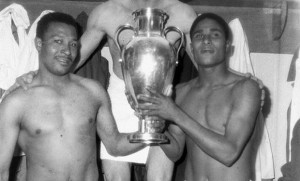 Eusebio and Coluna holding Champions League trophy
